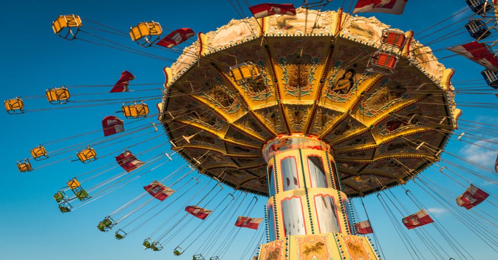 People Enjoying in Rollers At Amusement Park